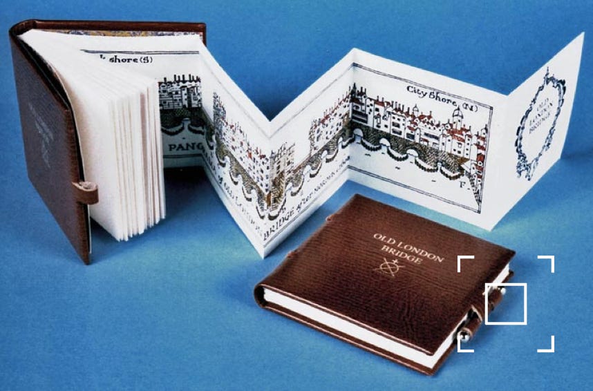 Two books showing front cover, loop and bar closure and pull-out illustration of Old London Bridge.